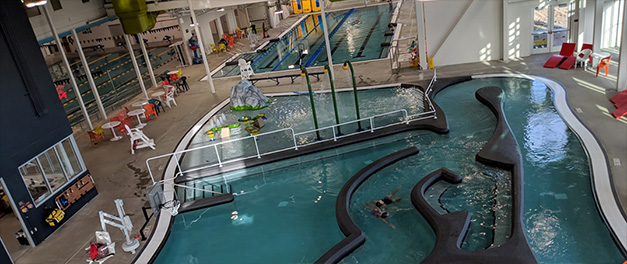 aerial view of the lazy river, program pool, and lap pool