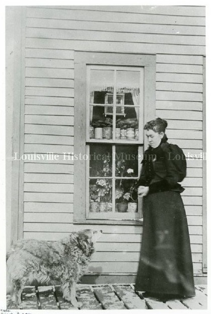 Woman looking down at dog
