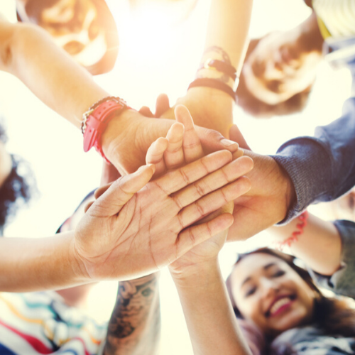 teens; hands in the middle of group