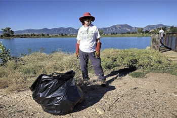 Volunteer Picking up Trash