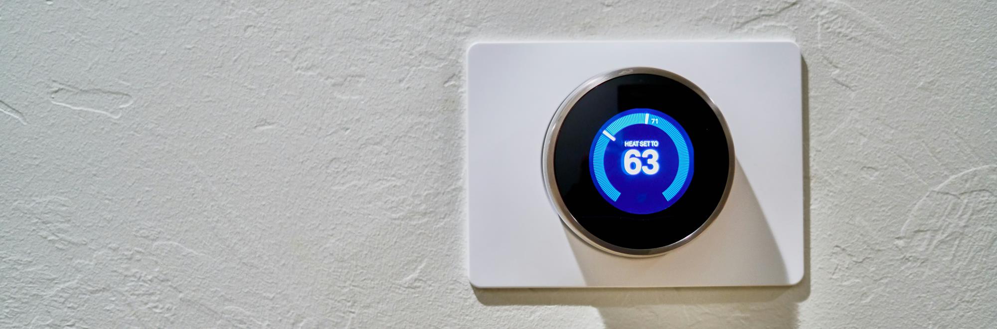 Image of thermostat hanging on the wall.